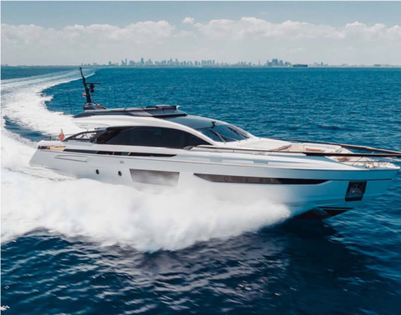 A Maritime yacht running past the Miami skyline